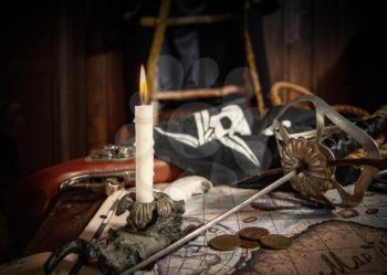 Items from pirated goods randomly laid out on the old ship's table