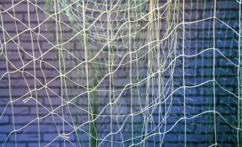 background of old fishing nets hung to dry