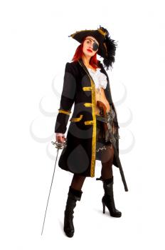 sexy girl in a pirate costume and a cocked hat stands armed with a sword on a white background in high heels.
