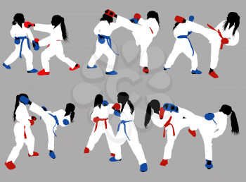 karate girls in white kimonos and red and blue belts and protective ammunition sparring against a gray background