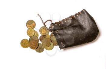 old black money bag made of leather and small copper different countries coins next to it on a white background