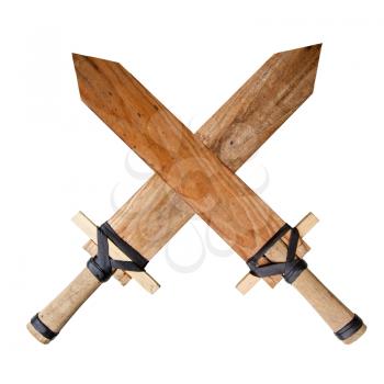 two children s homemade toy wooden swords crossed and isolated on a white background