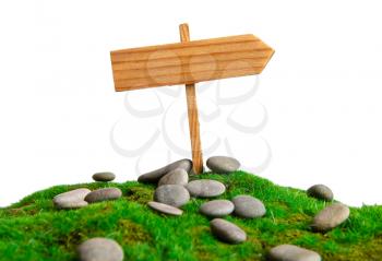 empty homemade wooden pointer towards the establishment of an artificial grass among the rocks