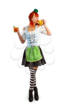 red irish waitress drinks beer from a glass goblet holding a second goblet in hand