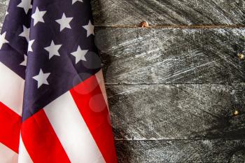 beautiful starry striped flag of united states of america on dark wooden background