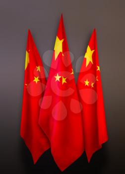 Three red with yellow stars of the Chinese flag on a dark gray background.