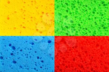 bright multi-colored background made up of kitchen washcloths closeup