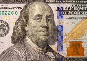 close-up image of Benjamin Franklin on United States of America Hundred Dollar Bill