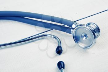 Medicine stethoscope on the white wooden desk