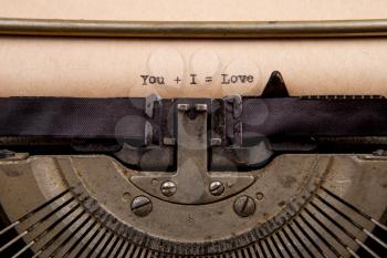 You plus I equal love - typed words on a Vintage Typewriter