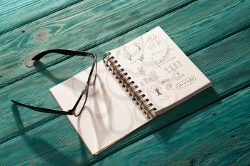 business concept - notepad with sketch on the desk under sunlight