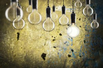 Idea and leadership concept - Vintage  bulbs on the grunge background