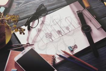 Real estate concept - sketch of architecture on the desk