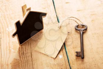 home security concept - little house and old key