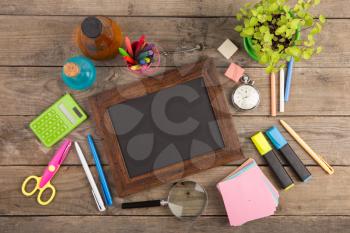 Back to school concept - school supplies on the wooden desk