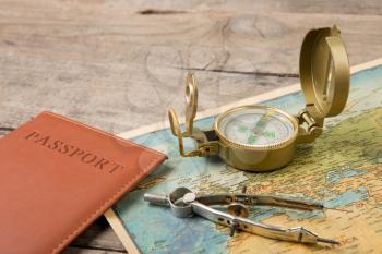 compass and vintage map on the wooden desk