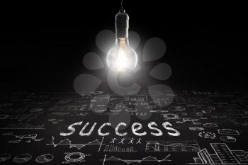 Business concept - word ' Success ', sketch with schemes and graphs on chalkboard