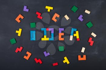 Business creative Idea concept - inscription and jigsaw on the blackboard