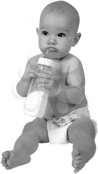 Royalty Free Black and White Photo of an Infant Child Holf=ding a bottle 