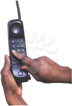 Royalty Free Photo of a Hand Dialing a Phone