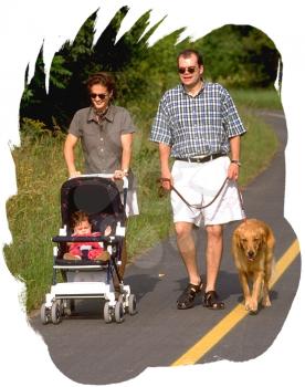 Royalty Free Photo of a Couple Walking Their Baby and Dog