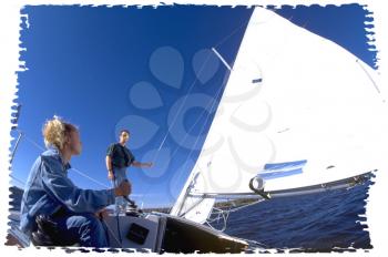 Royalty Free Photo of a Couple on a Sail Boat