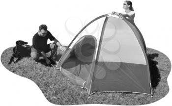 Royalty Free Photo of a Couple Pitching a Tent While the Dog Watches