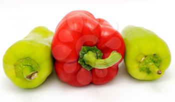 Red and green pepper placed on the white background.