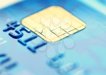 Closeup image of old blue credit card.