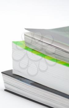 Stack of various book isolated on the white background.