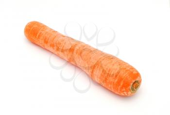 Detail image of one dirty carrot on the white background.