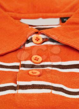 Detail image of orange shirt.