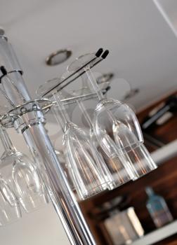 Hanging wine glasses in kitchen.