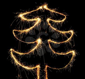 Abstract sparkler christmas tree on the black background.