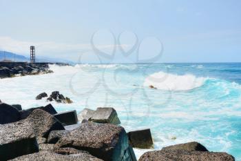 Artificial coast in the Atlantic Ocean created from blocks of stone in Puerto de la Cruz, Tenerife, Spain.