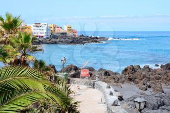 View of the Puerto de la Cruz coast and promenade. Punta Brava in background. Tenerife, Spain.