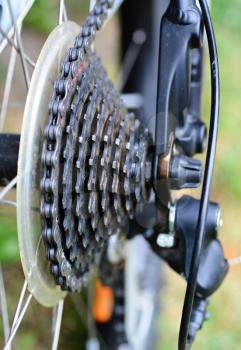 Dirty old used bycicle derailleur with chain.