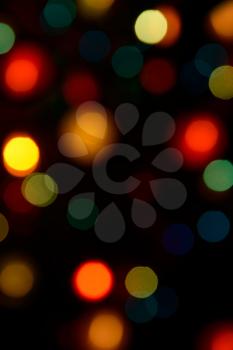 Color blurred bokeh lights. Useful for Christmas background or greeting cards.