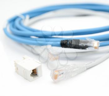 Blue and gray ethernet Cat5e cables with RJ45 cable extender on a white background.