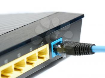 Blue ethernet cable plugs to the RJ45 port in the wireless router. 