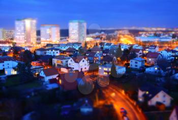 Prague city with big prefabs and houses at twilight with tilt-shift effect.