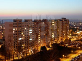 Housing development at sunset. Block of flats at night.