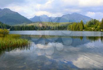 Wide angle landscape shot of Strbske Pleso lake in High Tatras mountains.