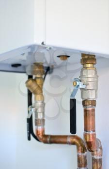 Heating copper pipes with valves connected to electric boiler.