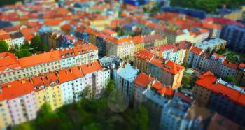 Tilt-shift effect view of the red roofs of Prague downtown.