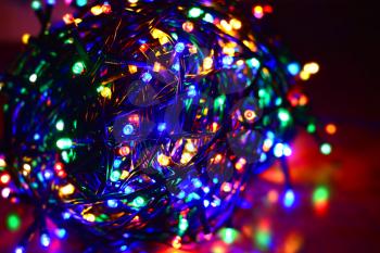 Closeup of a tangled multi color led string