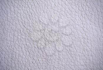 Full frame background of pebbled grey leather surface.