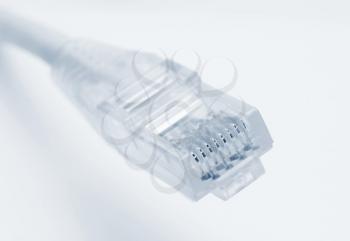 Closeup of rj45 connector of patch cable for LAN connection over white background.