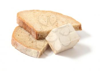 Fresh yeast block and two slices of bread over white background.