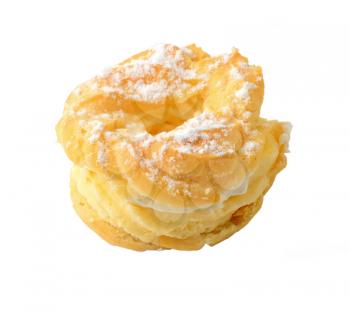 Sweet baked pastry in the shape of wreath with vanilla whipped cream and sprinkled with sugar, isolated over white background. Traditional Czech sweet pastry called venecek.